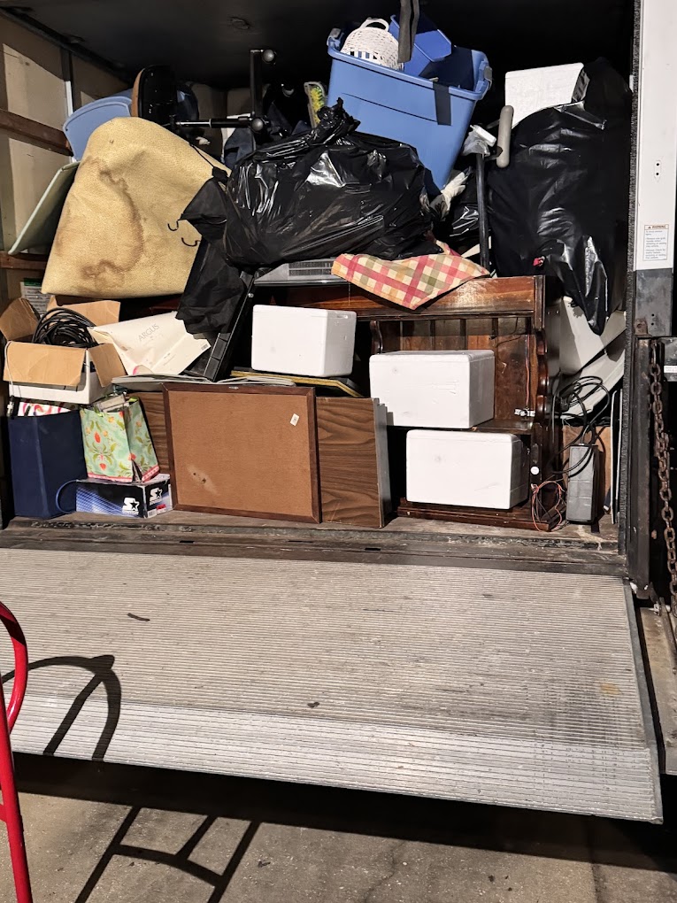 Back of box truck, full of junk