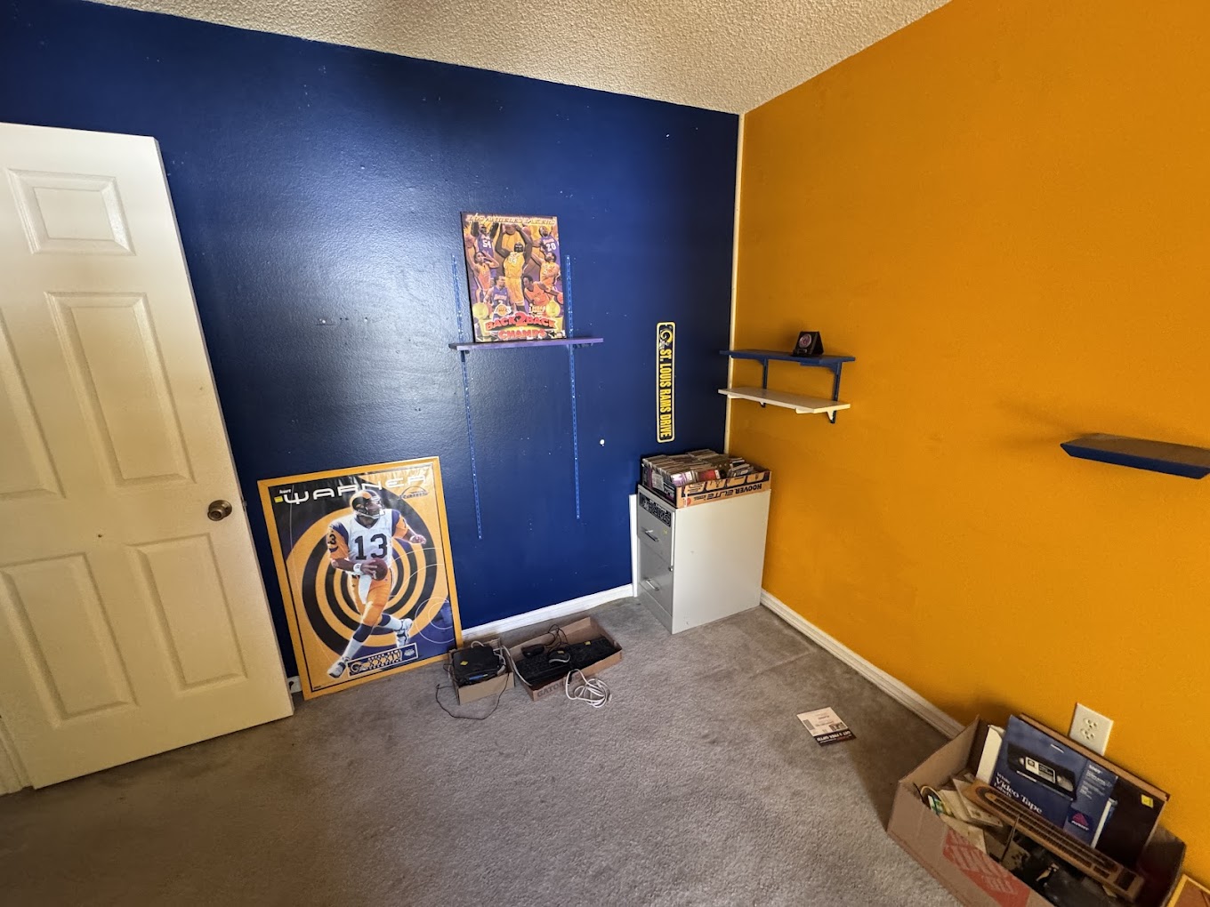 A bedroom with some assorted junk in the corner